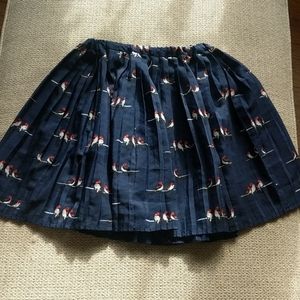 Pleated skirt with bird pattern